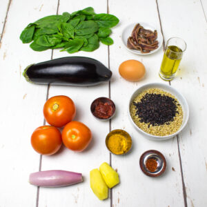 vegetable curry ingredients arranged on a white wooden table