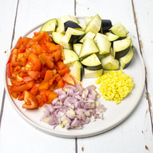 chopped vegetables on a white round plate