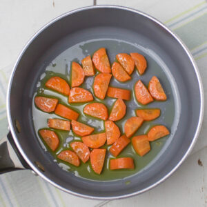 chopped carrot and olive oil in a pan